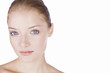 Portrait of a young woman with blue eyes and blonde hair