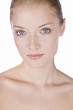 A young woman with blue eyes and blonde hair
