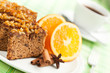 Foto: Gingerbread with orange and cup of coffee or tea. Gingerbread with orange and cup of coffee or tea.