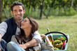 Couple drinking wine in vineyard