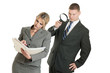 Photo: Business man spying on business woman with magnifying glass Business man spying on business woman with magnifying glass