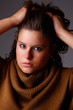 Beautiful woman with hands holding the hair, looking to camera Beautiful woman with hands holding the hair, looking to camera