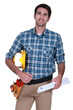 Male builder with plans