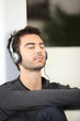 Man listening to music with eyes shut