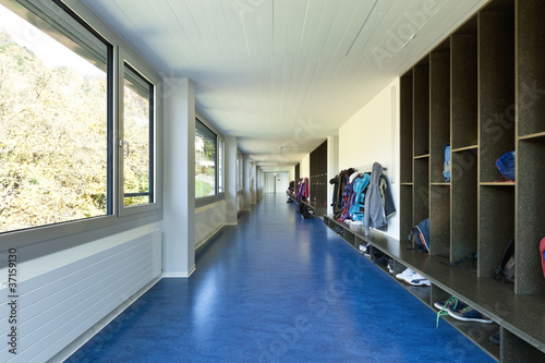 Photo: modern public school, corridor blue floor modern public school, corridor blue floor