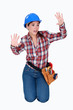 Tradeswoman stuck behind an invisible wall
