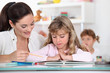 Primary school teacher with young girl