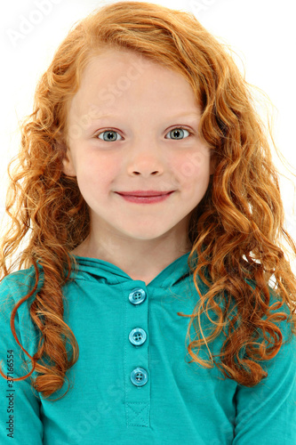 Foto: Close Up Girl Child with Orange Curly Hair and Blue Eyes Close Up Girl Child with Orange Curly Hair and Blue Eyes