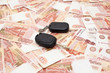 Car key on money cashnotes background
