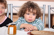 Grumpy toddler waiting to eat pancakes
