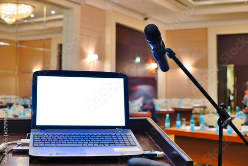 Photo: the rostrum with notebook waiting for a speaker the rostrum with notebook waiting for a speaker