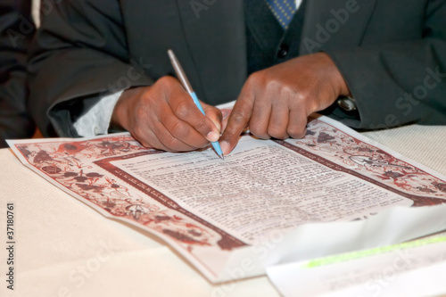 Photo: Jewish wedding, signing prenuptial agreement ketubah Jewish wedding, signing prenuptial agreement ketubah