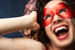 playful woman in carnival mask