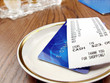 Receipt and credit card. Receipt and credit card.