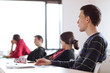 Photo: young, handsome male college student sitting in a classroom young, handsome male college student sitting in a classroom