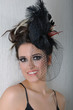 woman with interesting hairstyle smiling and posing