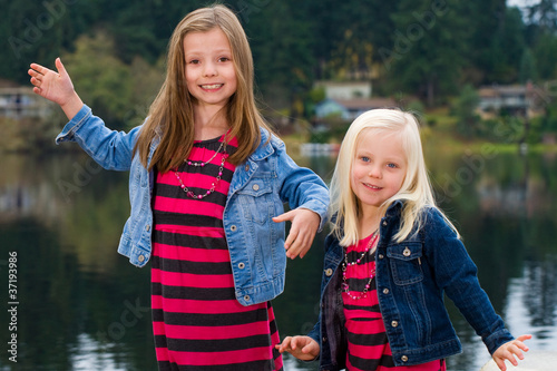 Photo: cute kids outside at a lake cute kids outside at a lake