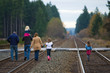 Photo: People walking on train tracks People walking on train tracks