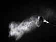 Make up brush with powder isolated on black