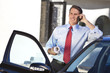 Businessman or Architect On Cell Phone By Car