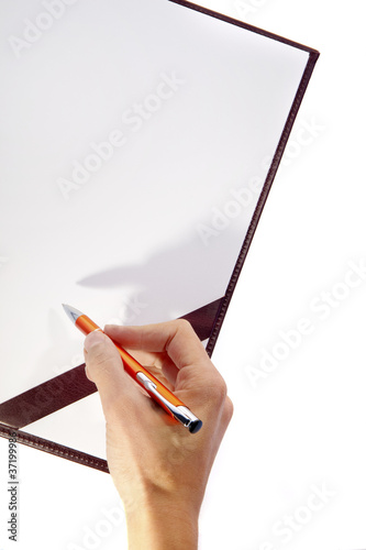 Photo: Writing hand on blank board Writing hand on blank board