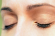 Woman relaxes by closing her eyes