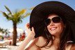 summer beach teen girl cheerful in panama and sunglasses