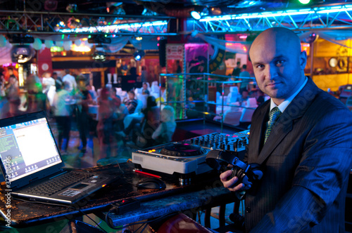 Photo: DJ behind the control panel DJ behind the control panel