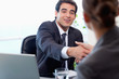 Photo: Smiling manager interviewing a female applicant Smiling manager interviewing a female applicant