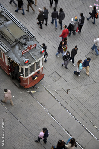 Photo: Tram and walking people on Istiklal Street Tram and walking people on Istiklal Street