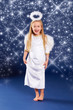 Photo: funny blond christmas angel with sparkling stars funny blond christmas angel with sparkling stars