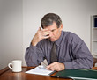 Overworked, Tired Businessman at Desk