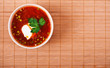 bowl of borscht on bamboo table cloth