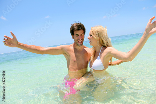 Photo: Couple enjoying vacation at the beach Couple enjoying vacation at the beach