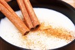 Two sticks of cinnamon on semolina with milk Two sticks of cinnamon on semolina with milk