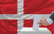 man voting on elections in denmark