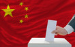 man voting on elections in china