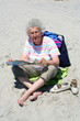 Photo: Senior Woman on Beach Reading Senior Woman on Beach Reading