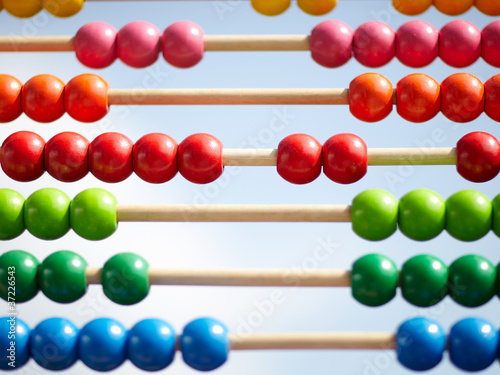 Photo: Wodden abacus in front of blue sky Wodden abacus in front of blue sky