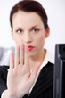 Closeup on woman`s hand gesturing stop.