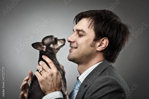 Photo: Businessman with his pet Businessman with his pet
