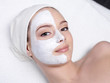 Woman getting facial mask