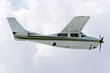 Small tourist plane over Caribbean beach in Mexico