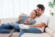 In love couple using a tablet computer