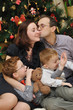 Foto: family near the Christmas-tree family near the Christmas-tree