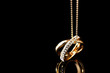 Pendant in form of rings with gem on black Pendant in form of rings with gem on black