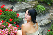 Adorable model in park with flowers