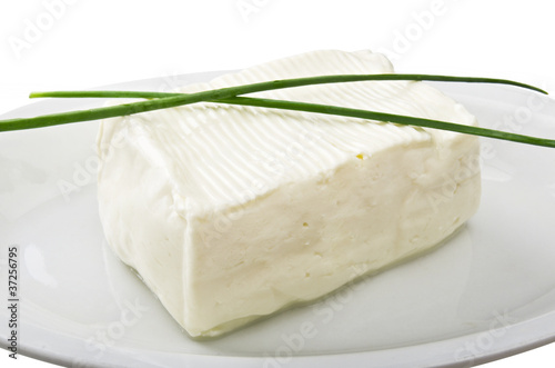 Photo: Soft cheese block in a plate Soft cheese block in a plate