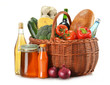 Grocery in wicker basket isolated on white Grocery in wicker basket isolated on white