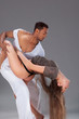 Young couple dances Caribbean Salsa, studio shot
